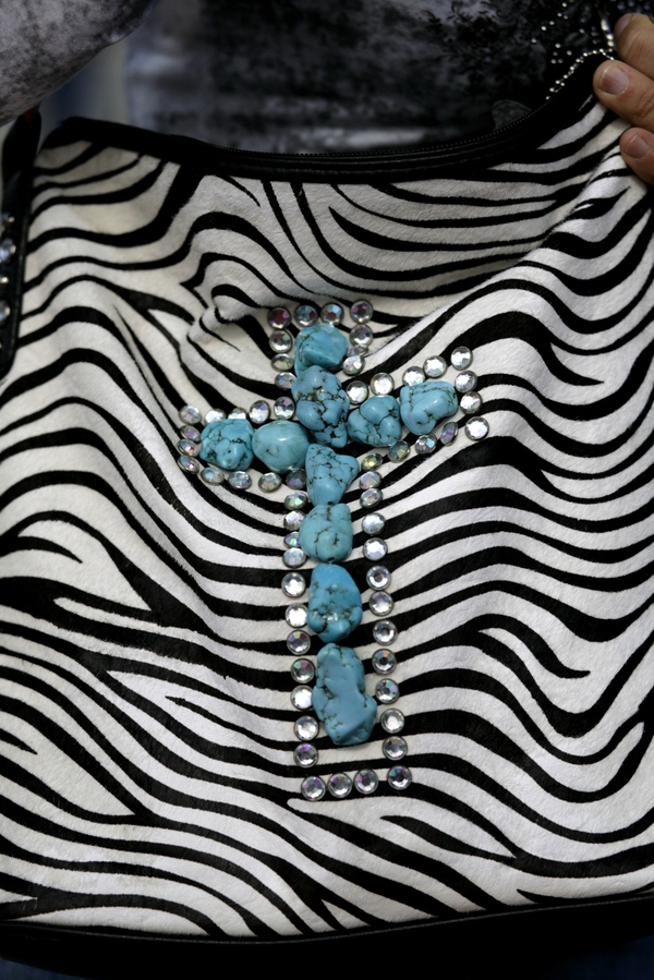 A zebra skin, turquoise encrusted purse at the PBR World ...