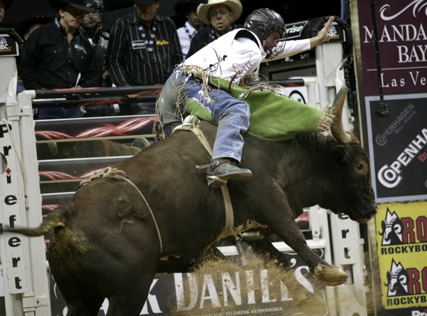 Bull riding at the final round of the PBR World ...