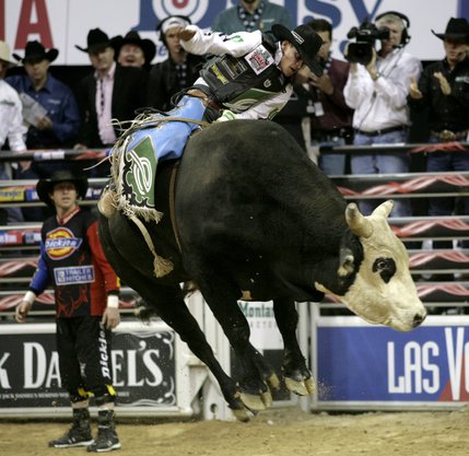 Bull riding at the final round of the PBR World Finals at the Thomas and Mack Center Sunday.  