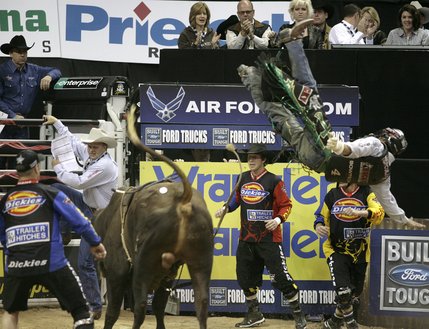Bull riding at the final round of the PBR World Finals at the Thomas and Mack Center Sunday.  