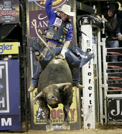 Bull riding at the final round of the PBR World Finals at the Thomas and Mack Center Sunday.  