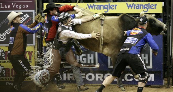 Bull riding at the final round of the PBR World ...