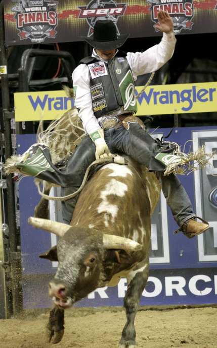 Bull riding at the final round of the PBR World Finals at the Thomas and Mack Center Sunday.  