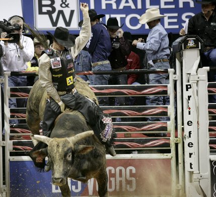Bull riding at the final round of the PBR World Finals at the Thomas and Mack Center Sunday.  