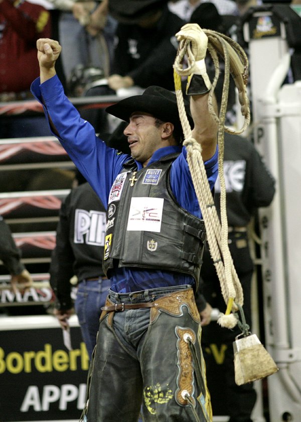 Bull riding at the final round of the PBR World ...