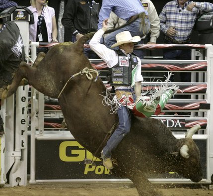 Bull riding at the final round of the PBR World Finals at the Thomas and Mack Center Sunday.  