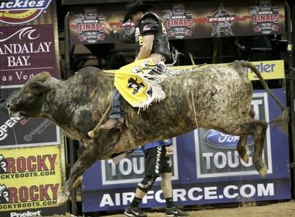 Bull riding at the final round of the PBR World Finals at the Thomas and Mack Center Sunday.  