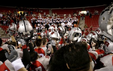 UNLV celebrates the win in front of the marching band and Rebels fans.