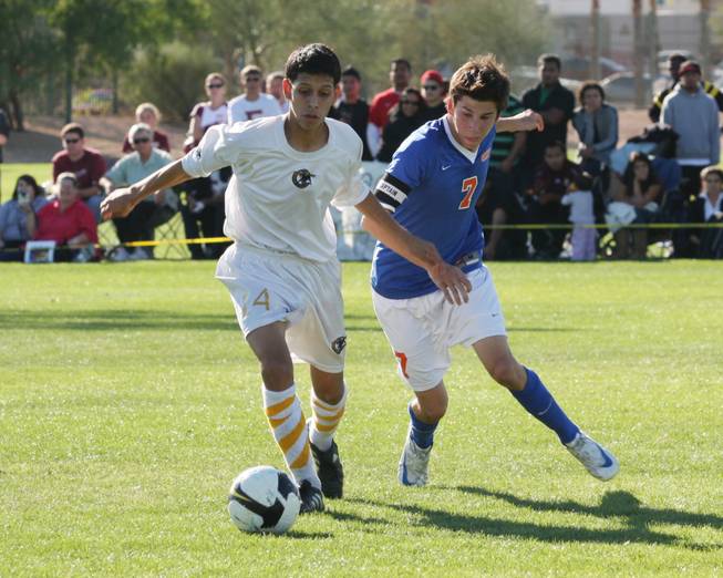 Clark midfielder Jerson Pinto attempts to keep the ball away from Bishop Gorman midfielder Nic Eary during the Sunset Regional boys soccer championship at Bettye Wilson Soccer Fields on Saturday.
