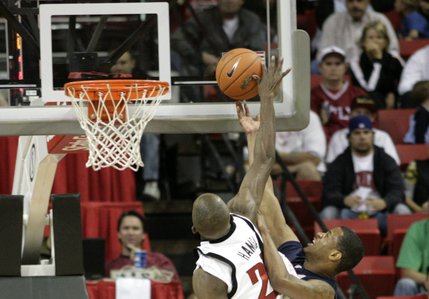 UNLV's Beas Hamga blocks a Washburn shot attempt.