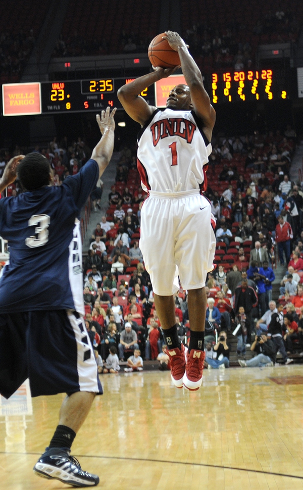 Wink Adams shoots one of 10 3-pointers for the game. ...