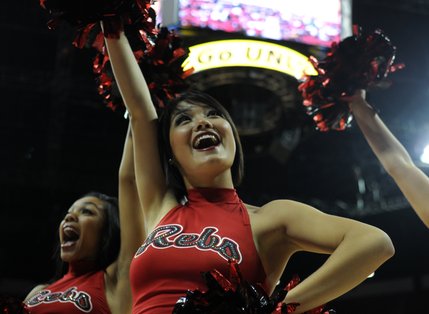 The Rebel Girls cheer for fans during a timeout.
