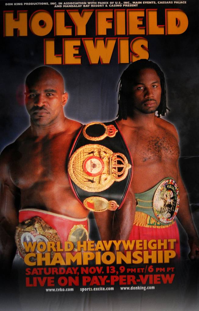 A poster for the heavyweight title fight between Evander Holyfield and Lennox Lewis is displayed inside the Thomas & Mack Center.