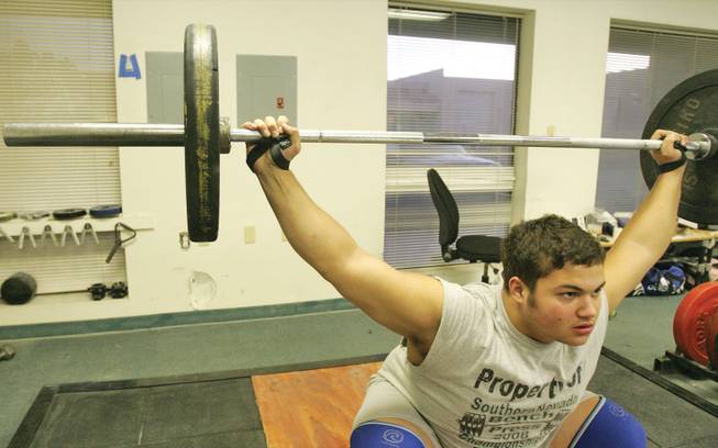 Del Sol graduate Pat Mendes exercises his lift Thursday, Nov. 6, at the Olympic-style weight lifting gym owned by John Broze.
