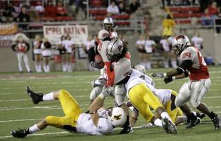 UNLV running back Frank Summers rushes during Thursday night's game against Wyoming at Sam Boyd Stadium.