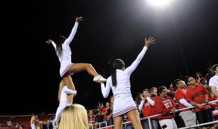 Cheerleaders do their part to fire up the crowd Thursday night at Sam Boyd Stadium. 