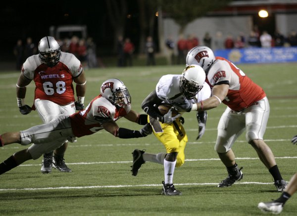 UNLV's line stops Tashaun Gibson at the line of scrimmage.