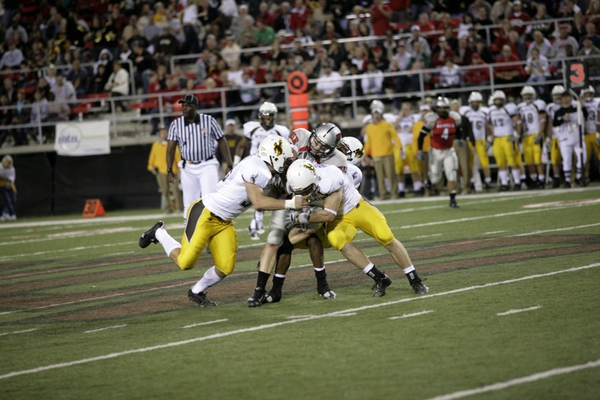 Three members of Wyoming's defense wrap up UNLV receiver Casey ...