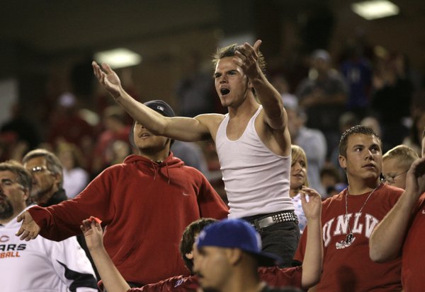 A Rebels fan gets upset about a call by the ...