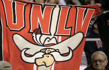 A fan holds up a banner Thursday night at Sam Boyd Stadium as the team plays Wyoming. 