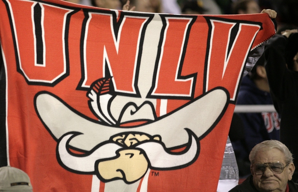A fan holds up a banner Thursday night at Sam ...