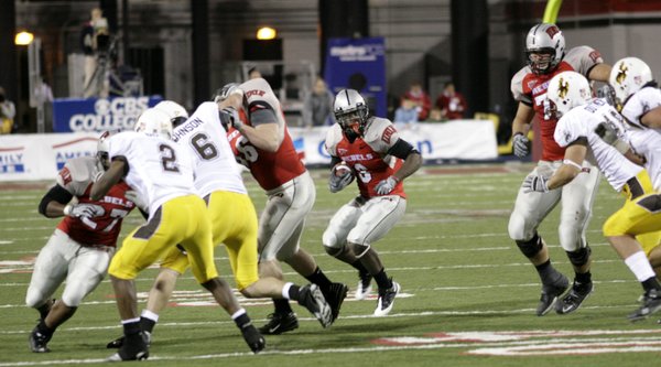 UNLV's C.J. Cox gets by Wyoming defenders Thursday night at ...