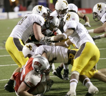 UNLV's Frank Summers meets Wyoming's defenders Thursday night at Sam Boyd Stadium. 