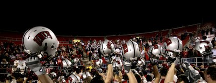 UNLV hold their helmets up in celebration after Thursday nights win.
