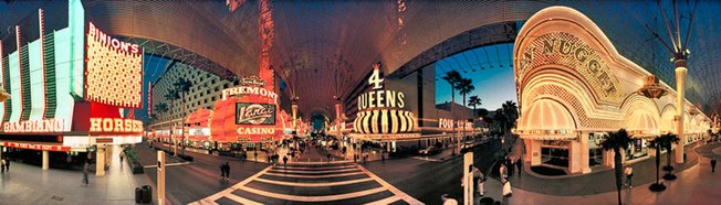 The view of Fremont Street downtown, bottom, includes many of Schiff's preoccupations: saturated colors, electric eye candy and tourists.
