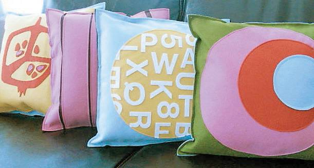 Some pillows made for The Girl Next Door show where local artists, many of them Summerlin moms, can sell hand-made, trendy items.