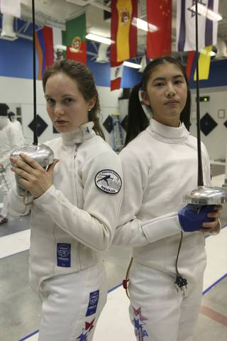 Fierce competitors Dakota Root, 16, and Nik-Nik Ameli, 15, right, of the Fencing Academy of Nevada, will represent America at the Federation International fencing tournament in Germany and Austria.