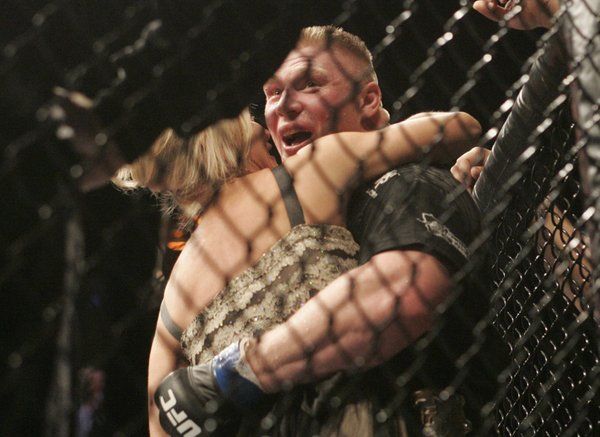 New UFC Heavyweight champion Brock Lesnar gets a kiss from ...