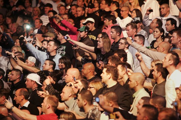 Fans take photos as Randy Couture enters the arena before ...