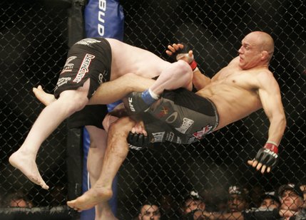 Brock Lesnar drops Randy Couture to the mat during the first round of their heavyweight championship bout at UFC 91 Saturday, November 15, 2008 at the MGM Grand Garden Arena. Lesnar won by TKO in the second round.