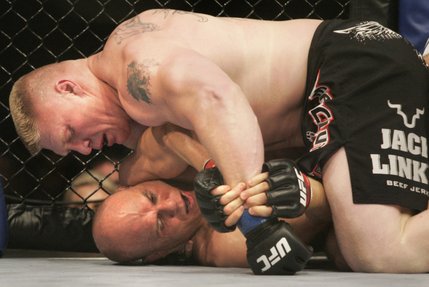 Brock Lesnar works one of Randy Couture's pressure points during the first round of their heavyweight title fight Saturday, November 15, 2008 at the MGM Grand Garden Arena. Lesnar took Couture's title with a second-round TKO.