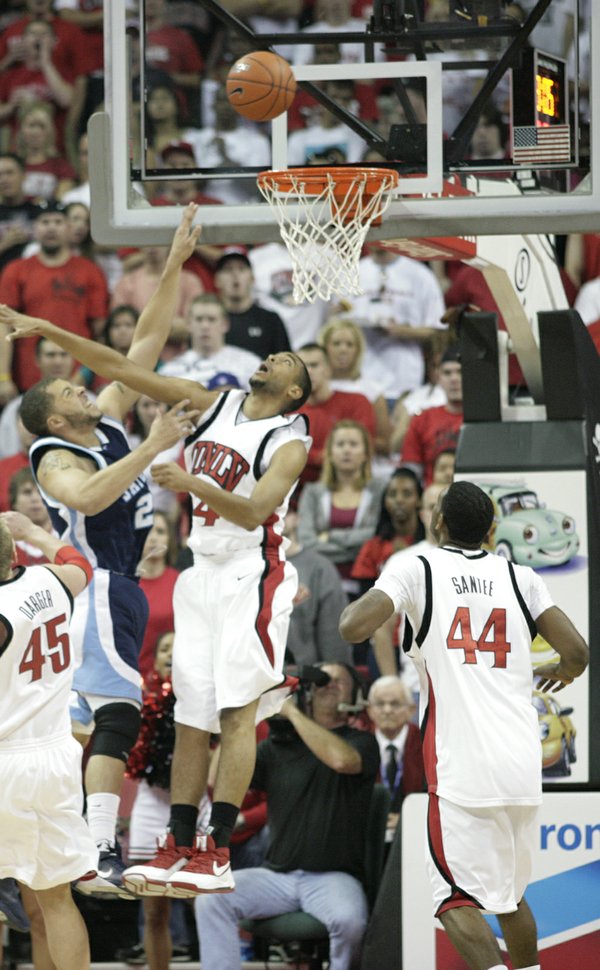 UNLV's Rene Rougeau contests San Diego State's Rob Jones.