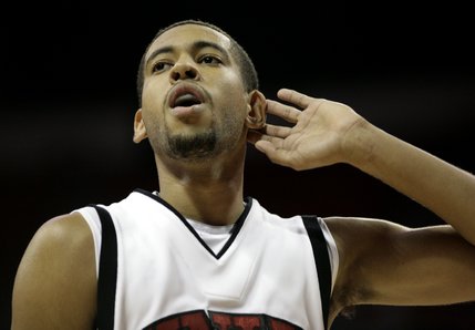 UNLV's Rene Rougeau gets the crowd to make some noise at the end of the home opener Saturday with San Diego.  UNLV won, 65-60.