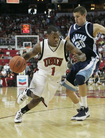 UNLV guard Wink Adams drives past San Diego guard Matt Dorr duing the second half Saturday, Nov. 15, 2008, at the Thomas & Mack Center. UNLV won 65-60.