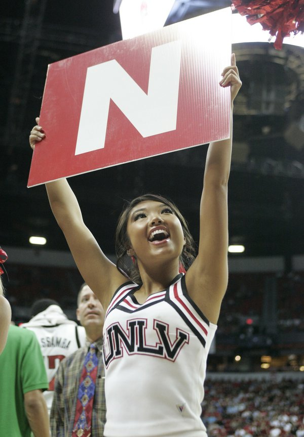 UNLV cheerleader Lauren Gokami leads a cheer during the Rebels' ...