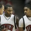 UNLV coach Lon Kruger talks to guards Wink Adams, left, and Oscar Bellfield during the second half of their game against San Diego on Saturday at the Thomas & Mack Center. UNLV won 65-60. 