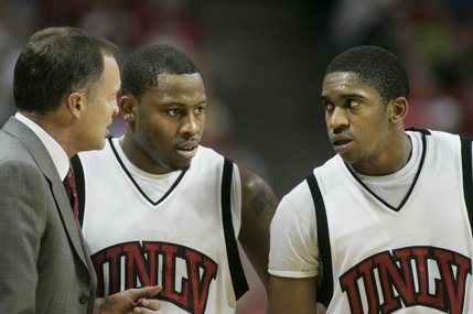 UNLV coach Lon Kruger talks to guards Wink Adams, left, and Oscar Bellfield during the second half of their game against San Diego on Nov. 15 at the Thomas & Mack Center. UNLV won 65-60. 