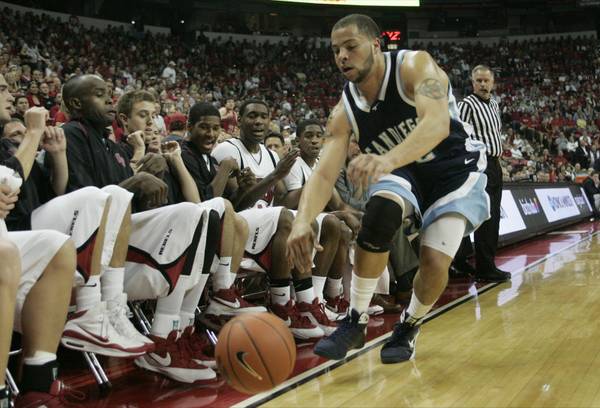 The UNLV bench jumps back as San Diego forward Rob ...