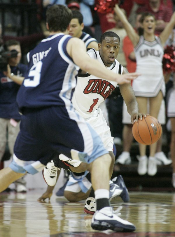 UNLV guard Wink Adams brings the ball upcourt after a ...