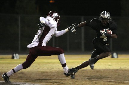 Palo Verde running back Sidney Hodge dodges Cimarron-Memorial defensive back Roderick Washington during the Sunset Regional semifinals at Palo Verde High School on Nov. 14. Hodge verbally committed to UNLV on Jan. 26.
