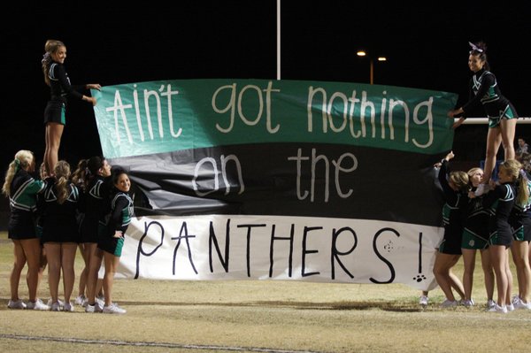 The Palo Verde Cheerleaders prepare the banner for the football ...