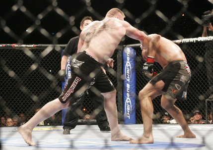 Challenger Brock Lesnar hits heavyweight champion Randy Couture with a right behind the ear that knocked Couture to the mat during the second round Saturday, November 15, 2008 at the MGM Grand Garden Arena. A flurry of punches later Lesnar won by TKO.  SAM MORRIS / LAS VEGAS SUN