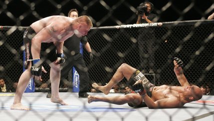 Challenger Brock Lesnar gets ready to pounce on champion Randy Couture after knocking him to the ground with a right hand during the second round of their title fight Saturday, November 15, 2008 at the MGM Grand Garden Arena. Moments later Lesnar landed a flurry of punches to score a TKO victory and secure himself the heavyweight title belt.