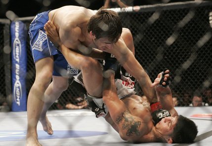 Kenny Florian hits Joe Stevenson with a left during the first round of their lightweight bout at UFC 91 Saturday, November 15, 2008 at the MGM Grand Garden Arena in Las Vegas. Florian submitted Stevenson a few moments later with a rear-naked choke hold.
