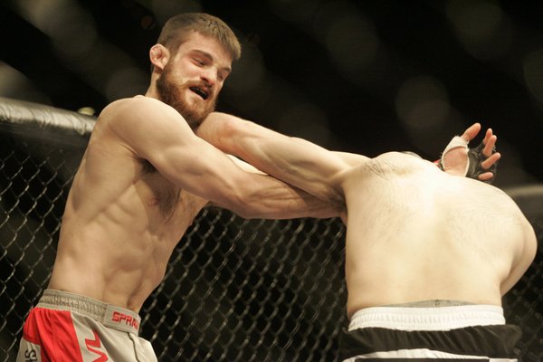 Dustin Hazelett and Tamdan McCrory trade punches during their welterweight ...