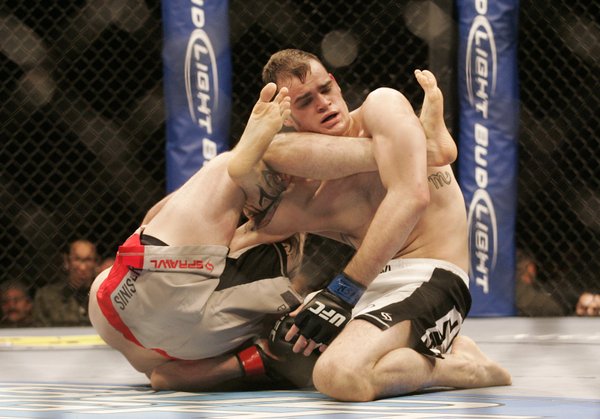 Dustin Hazelett, left, starts to get Tamdan McCrory into an ...